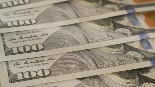 Close-up rows of American paper currency 4K 2160p 30fps UltraHD tilting footage - Many 100 dolla