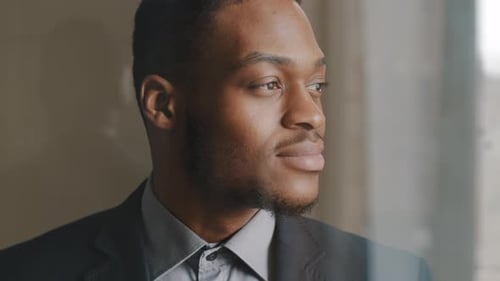 Young Man in Suit Looking Away