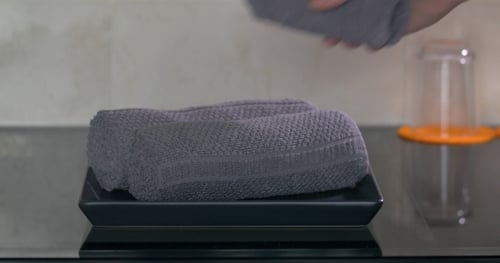 At Table In Hotel Are Rolled-up Towels