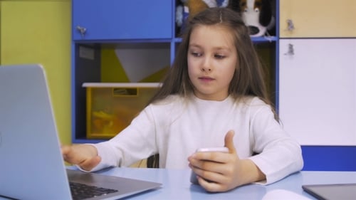 Girl Using a Laptop Notebook Computer at School