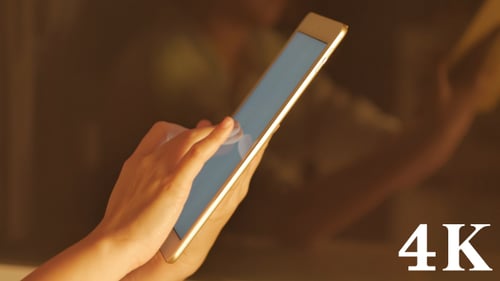 Woman Using Gold Trim Tablet Close Up