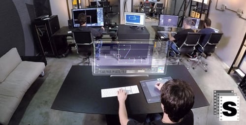 Adults Working at Computers in Modern Office