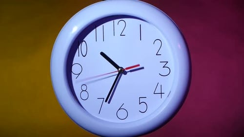 Close Up of an White Clock on Colorful Background