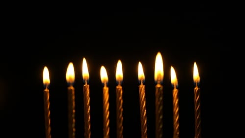 Golden Burning Candles Set On Black Background.
