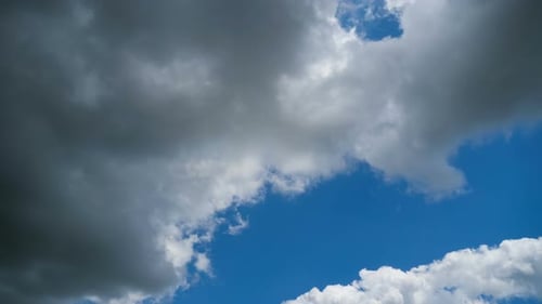 Clouds Drifting Across a Blue Sky in Time-lapse
