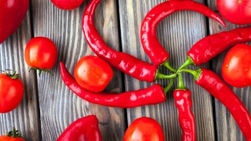 Peppers And Tomato On Wood Background
