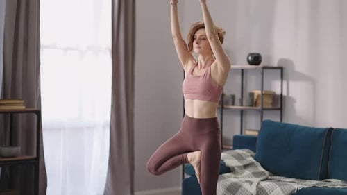 Woman Doing Yoga in Her Living Room