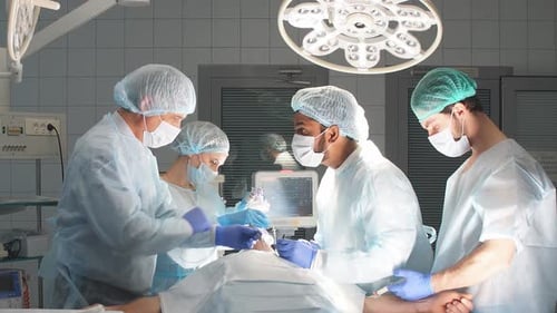 Medical Team Performing Surgery in Hospital Operating Room