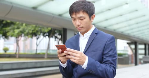 Businessman use of mobile phone