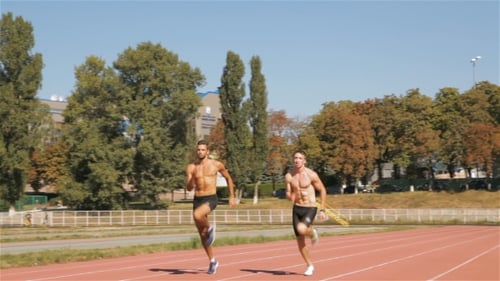Two Athlets Sprinting At The Stadium