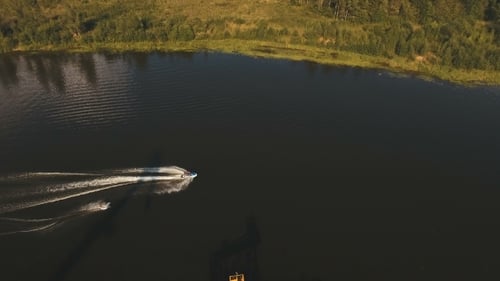 Wakeboarder Surfing On The river.Aerial Video.