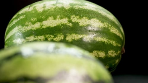 Two Watermelons at Black Background
