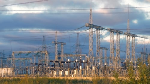 Electrical Substation Infrastructure Under Cloudy Sky