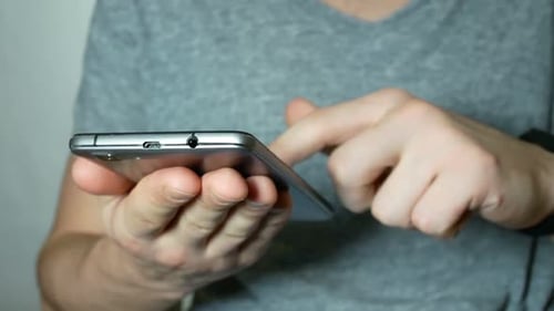 Hands Using Smartphone Technology Close Up