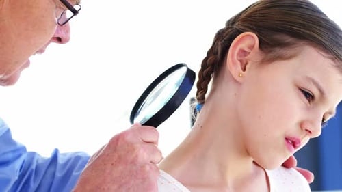 Doctor Examining Child's Skin with Magnifying Glass