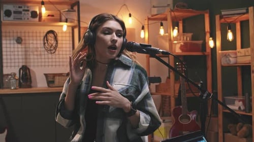 Rock Woman Singing In Microphone In Recording Studio