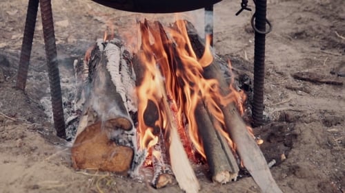 Campfire Burning Under a Cauldron