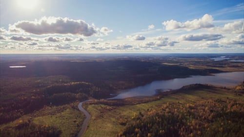 Beautiful Landscape With Fast Floating Clouds, Trees, Lakes And Rivers. Shot From The Height Of Bird
