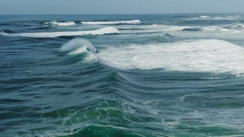 Picturesque Ocean with Rolling Waves on Sunny Day Upper View