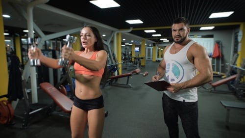 Personal Coach Control Exercising Of His Client