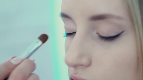 Close-Up of Makeup Artist Applying Eyeshadow