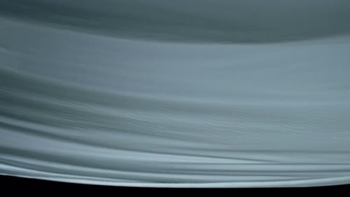Abstract Billowing White Sheet Against Black Background