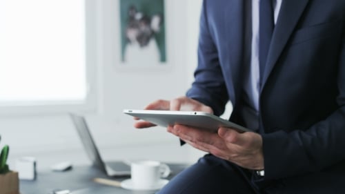 Man Using Tablet in an Office Environment