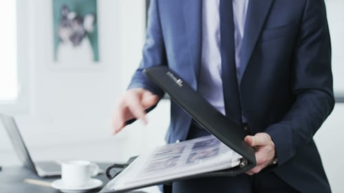 Businessman checking a file of documents
