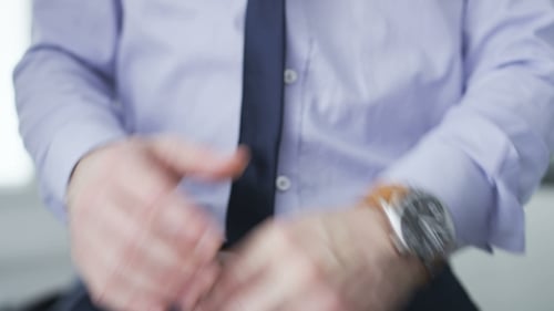 Businessman checking hour on his watch