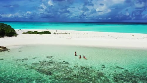 Beautiful women posing on luxury bay beach break by blue sea with white sand background of the Maldi
