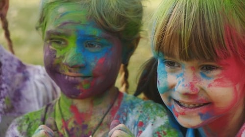 Kids Celebrate Holi Festival with Colorful Powder