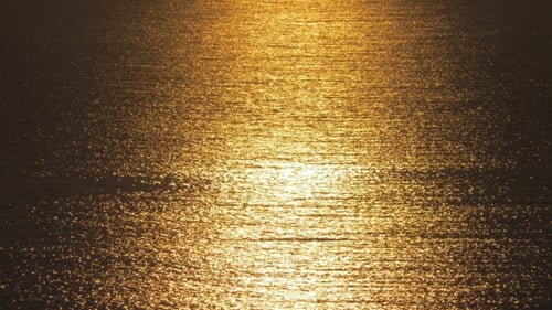 Beautiful Golden Sunset On Sea With Waves