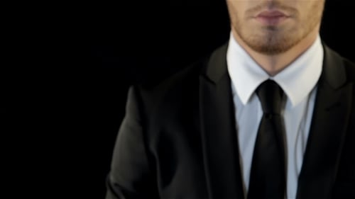 Man in Suit Making a Fist