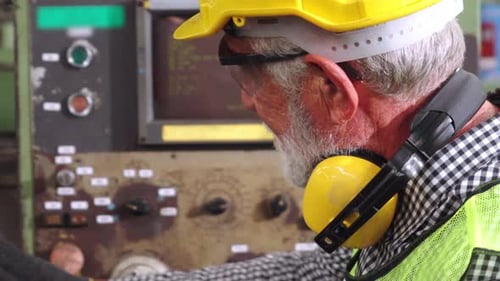 Senior Factory Worker Teach How to Use Machine Equipment in the Factory Workshop