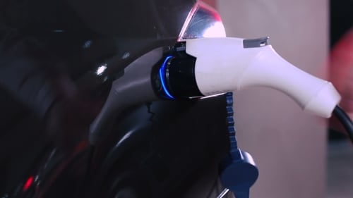 Plugging Charger Into Electric Car Port