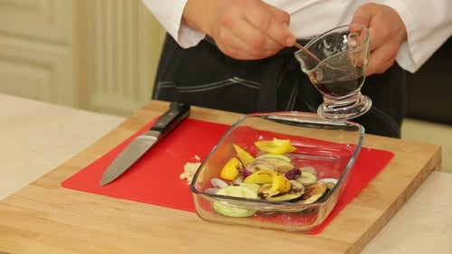 Chef Preparing Vegetables for Baking in Kitchen