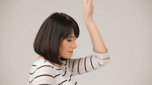 Young Brunette Smiling And Dancing