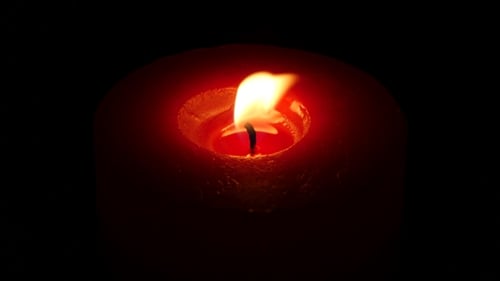 Beautiful Red Candle On Dark.