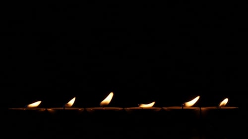 Six Small Candles In Dark.