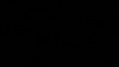 Close Up Candle Light With Match in Darkness