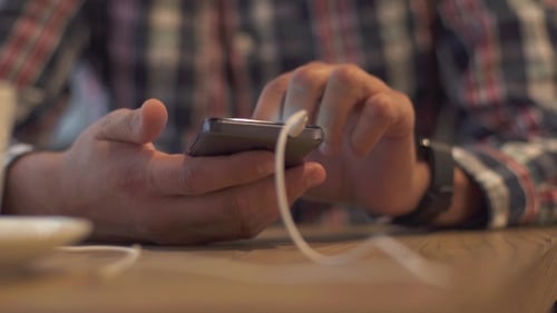 Of a Student Man Using Smart Phone Cafe