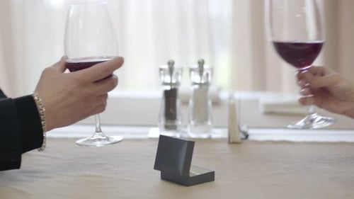 Engagement Ring with Wine Toast at Restaurant