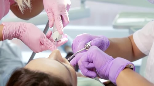 Dentists Working on Patient's Teeth