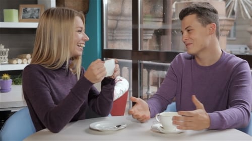 Couple Has a Pleasant Conversation At The Cafe