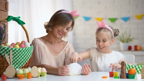 Woman and Child Petting a Bunny at Easter