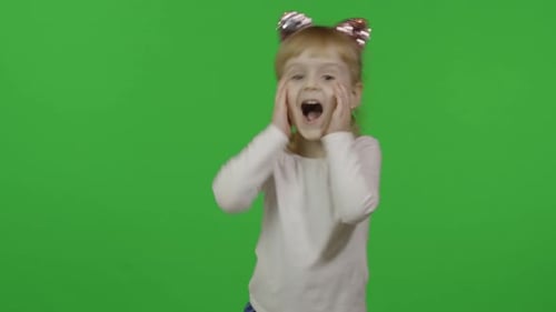 Enthusiastic Girl Dancing Against a Green Screen