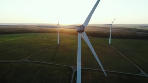 Wind Turbines Spinning at Sunrise