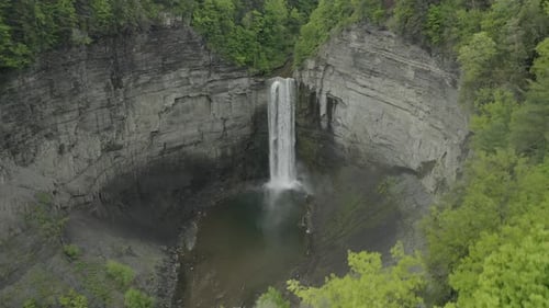 Beautiful Waterfall Cascading Through Lush Green Landscape