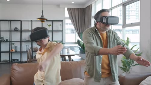 Father and Son Enjoying Virtual Reality Game Together