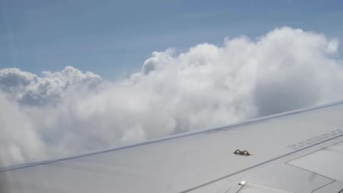 Clouds and Airplane Wing in the Sky